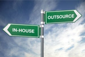 Directional signs showing "In-House" and "Outsource"