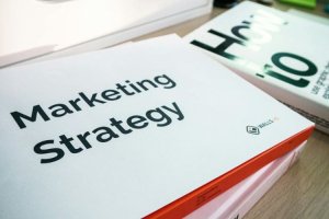  Close-up of a book titled “Marketing Strategy” on a desk.