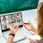 Woman attending a video conference with multiple participants.