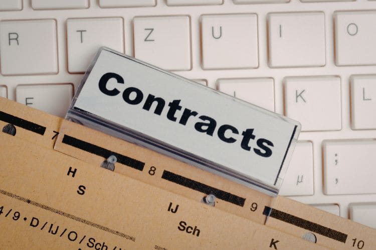 Business contract documents and filing system on office desk for legal administration